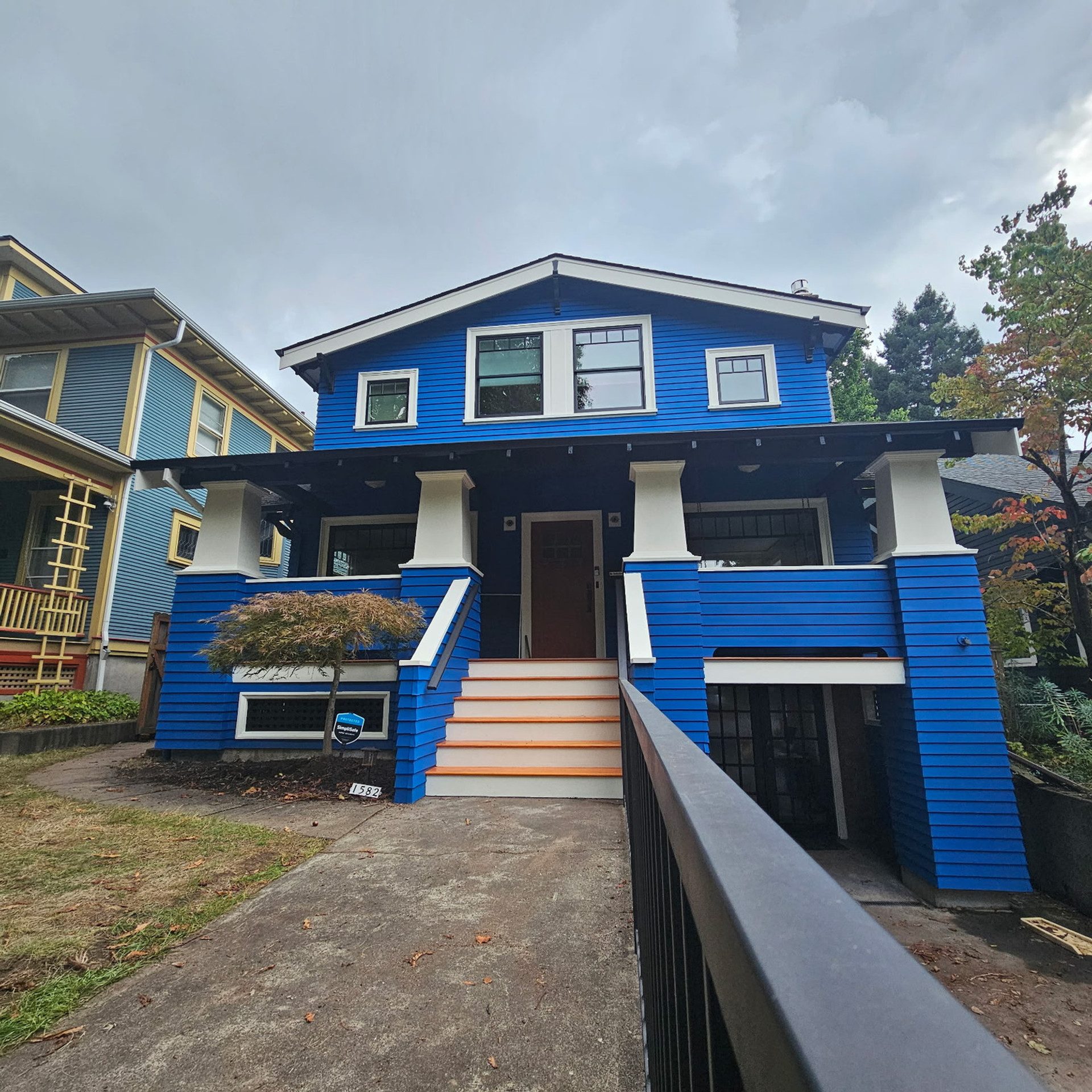 Royal blue Craftsman exterior repaint in Ladd's Addition